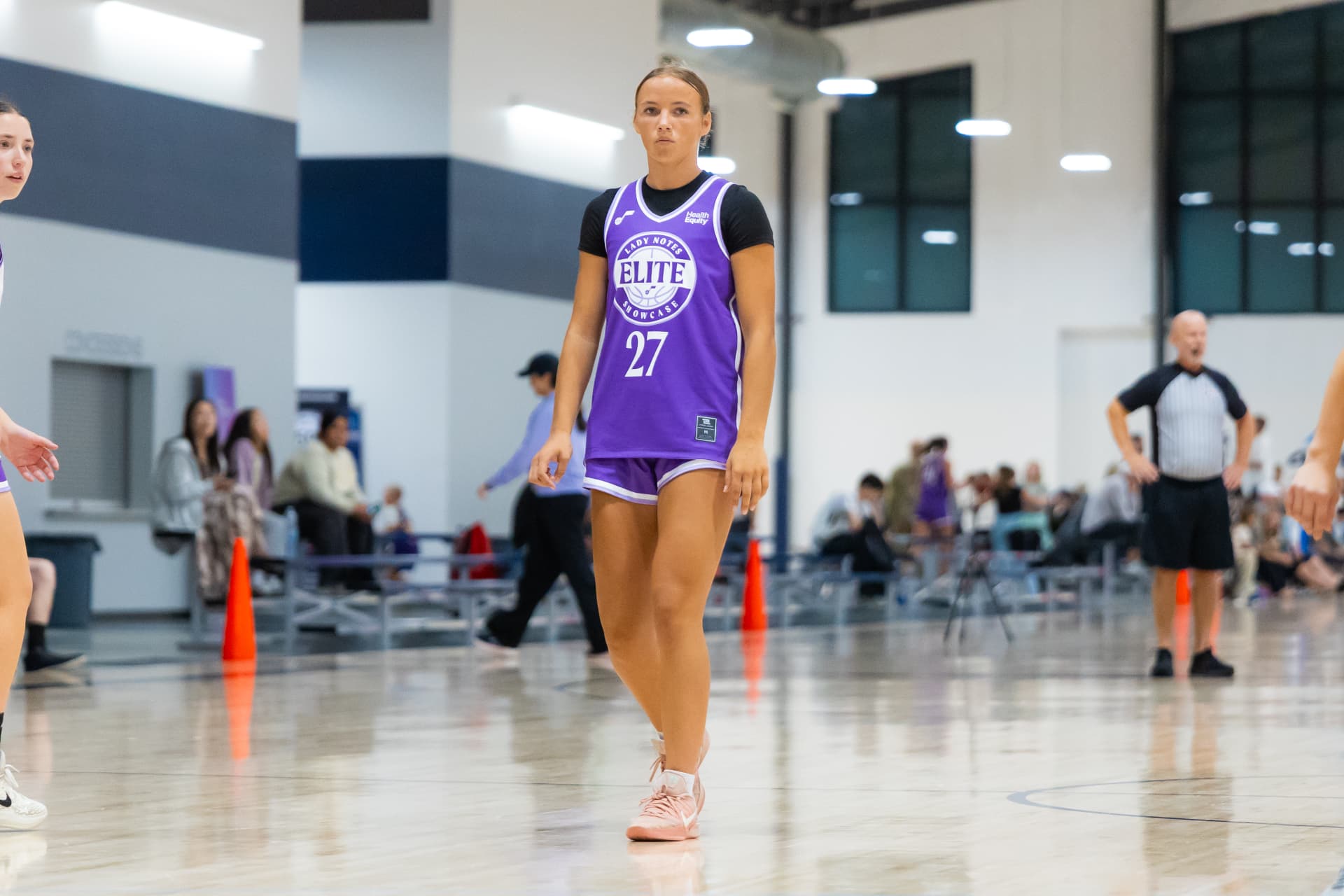 Lady Notes player in a purple Elite Showcase uniform during a game