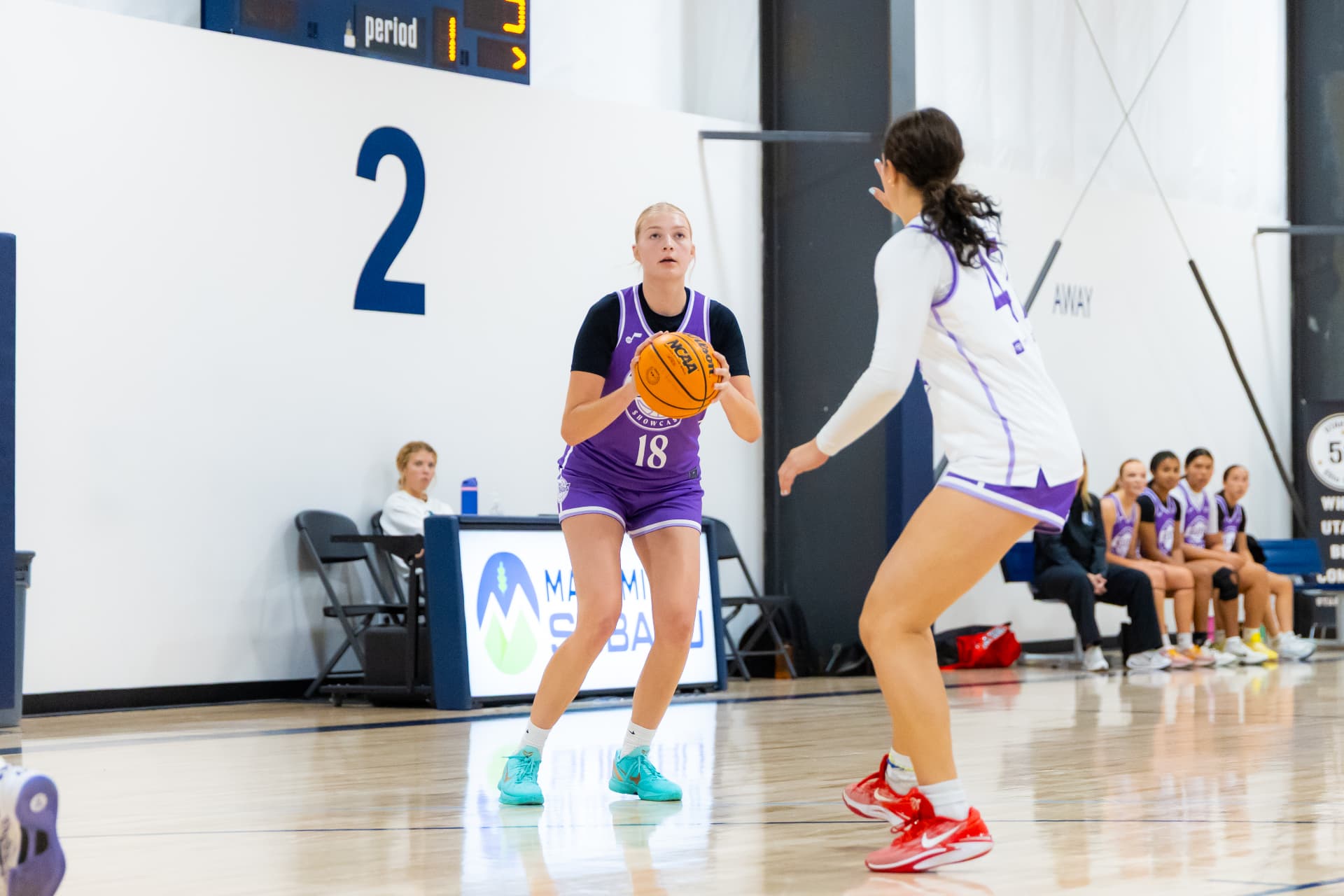 Lady Notes player preparing to shoot against a defender